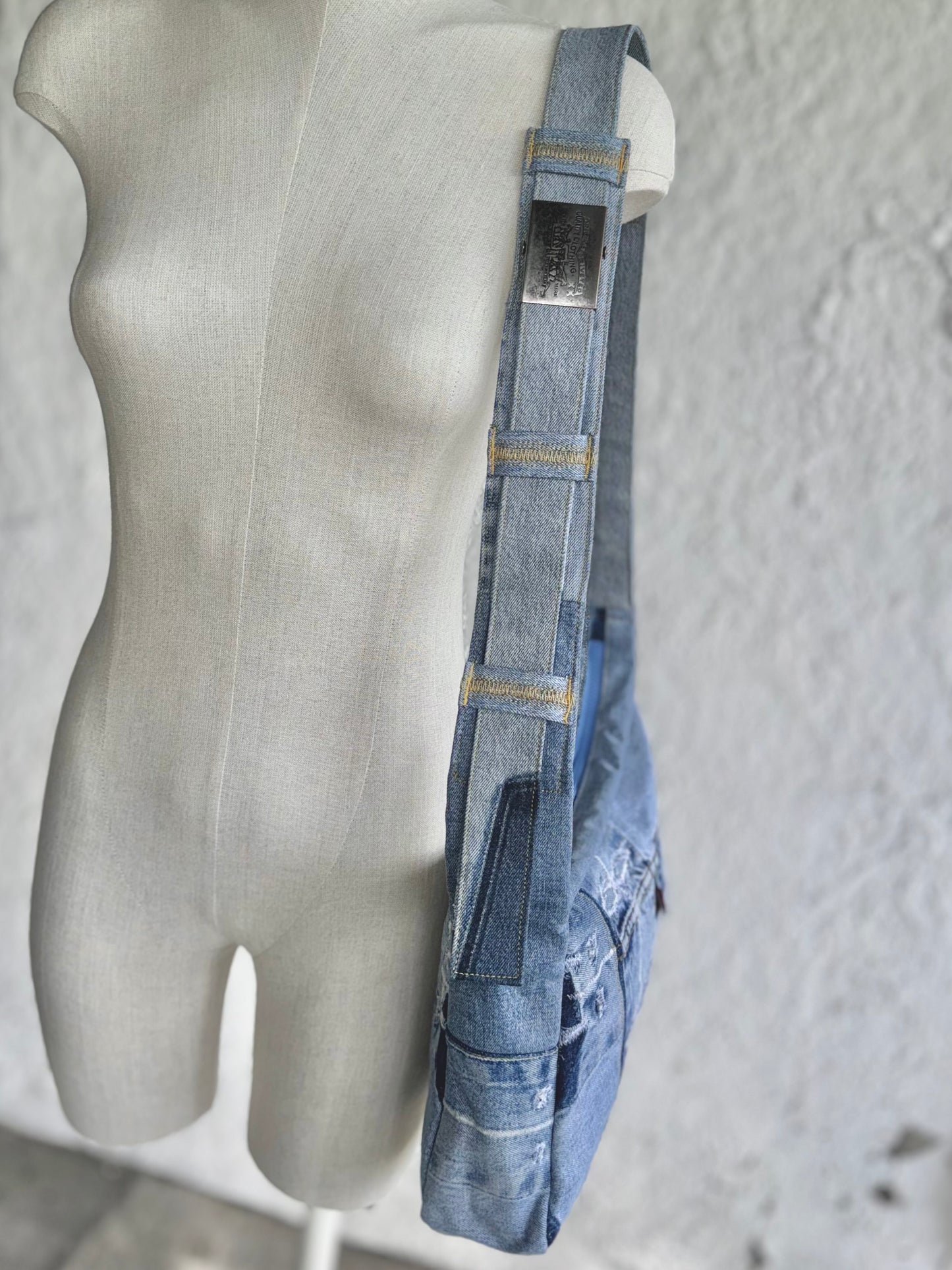 upcycled light blue denim laptop bag with a levi's buckle by KIOKU Studio