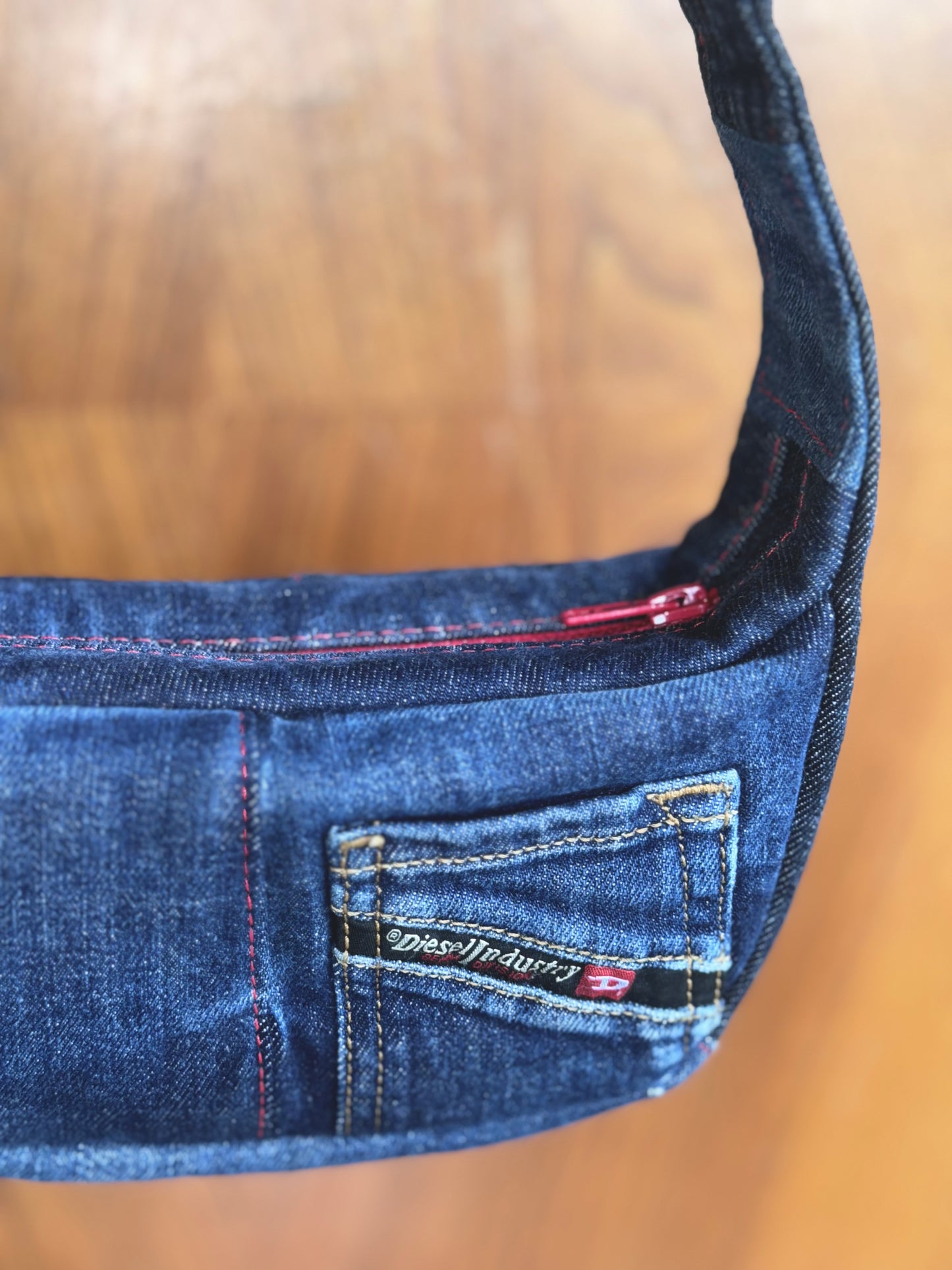 upcycled denim handbag, dark blue Diesel denim, red zipper