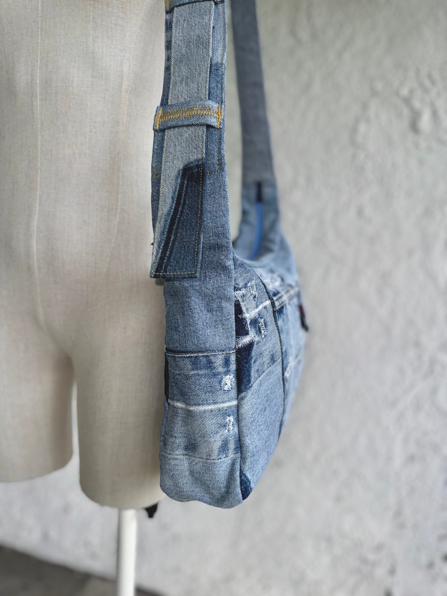 upcycled light blue denim laptop bag with a levi's buckle by KIOKU Studio