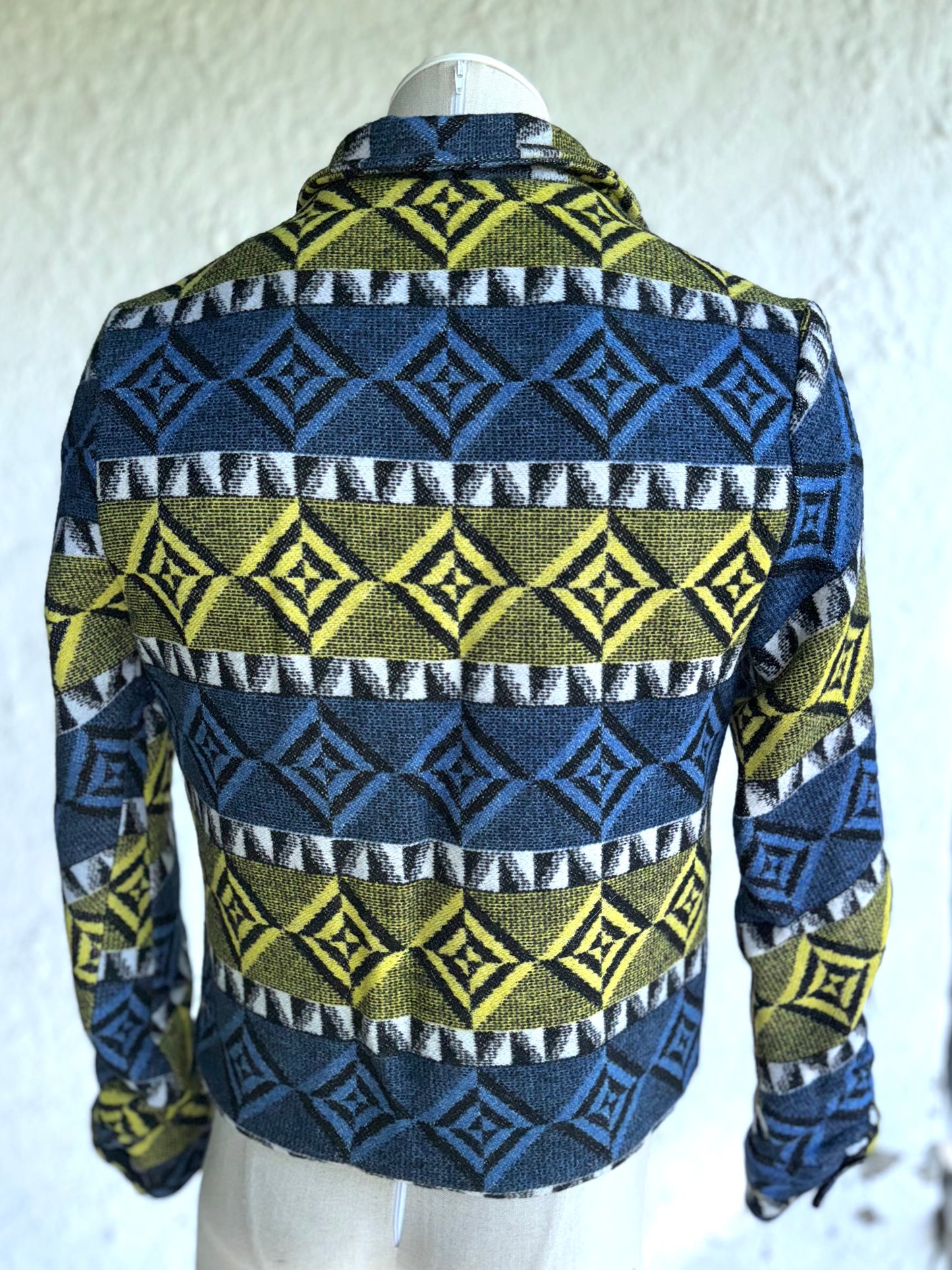 back of the blue and yellow one of a kind short jacket