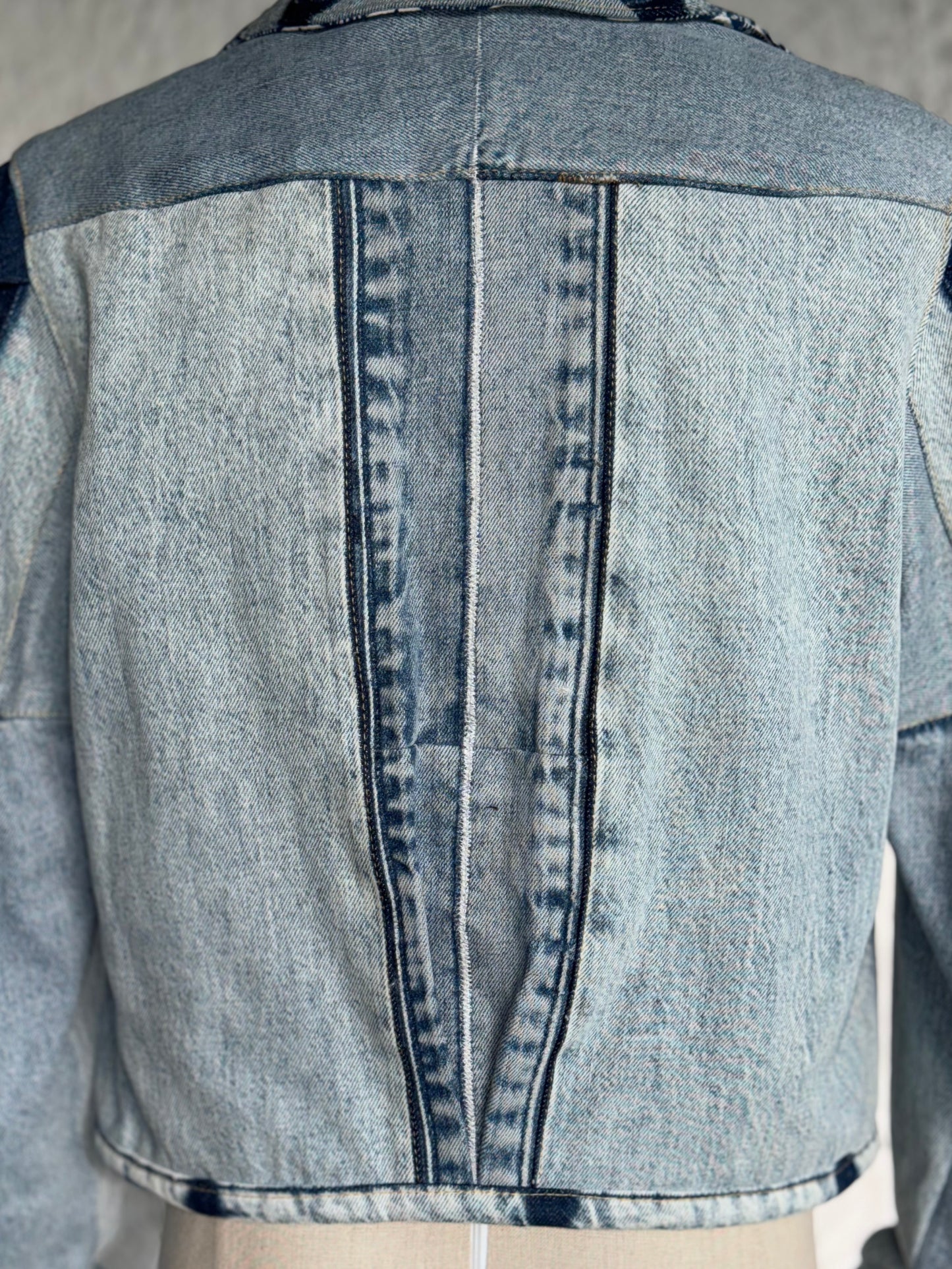 cropped patched denim jacket by KIOKU Studio back detail close up