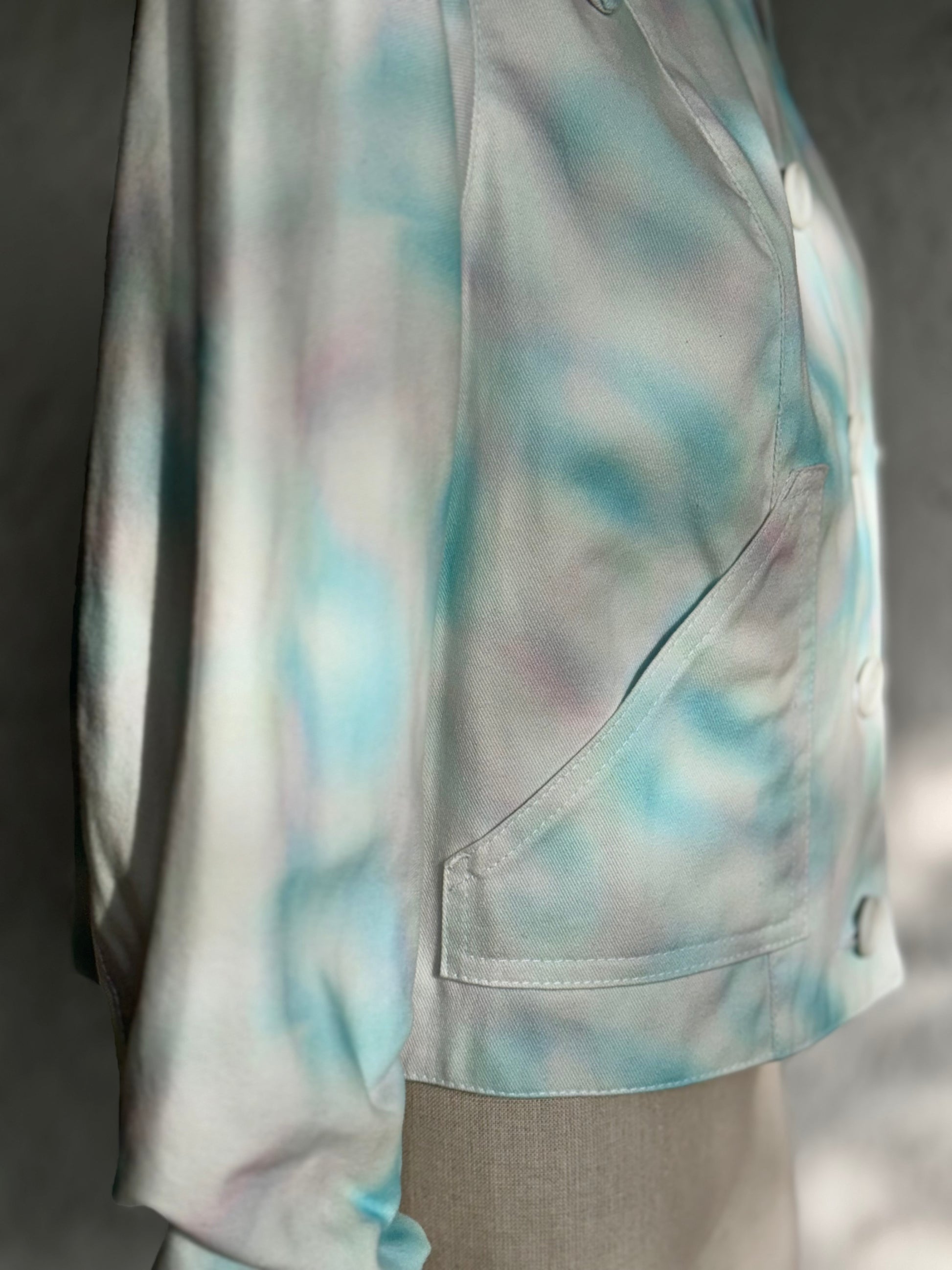 aqua blue spotted white denim jacket by KIOKU Studio pocket detail close up