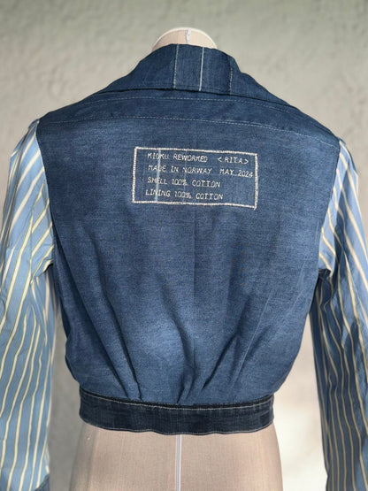 dark blue reversible cropped denim jacket by KIOKU Studio reversed side close up