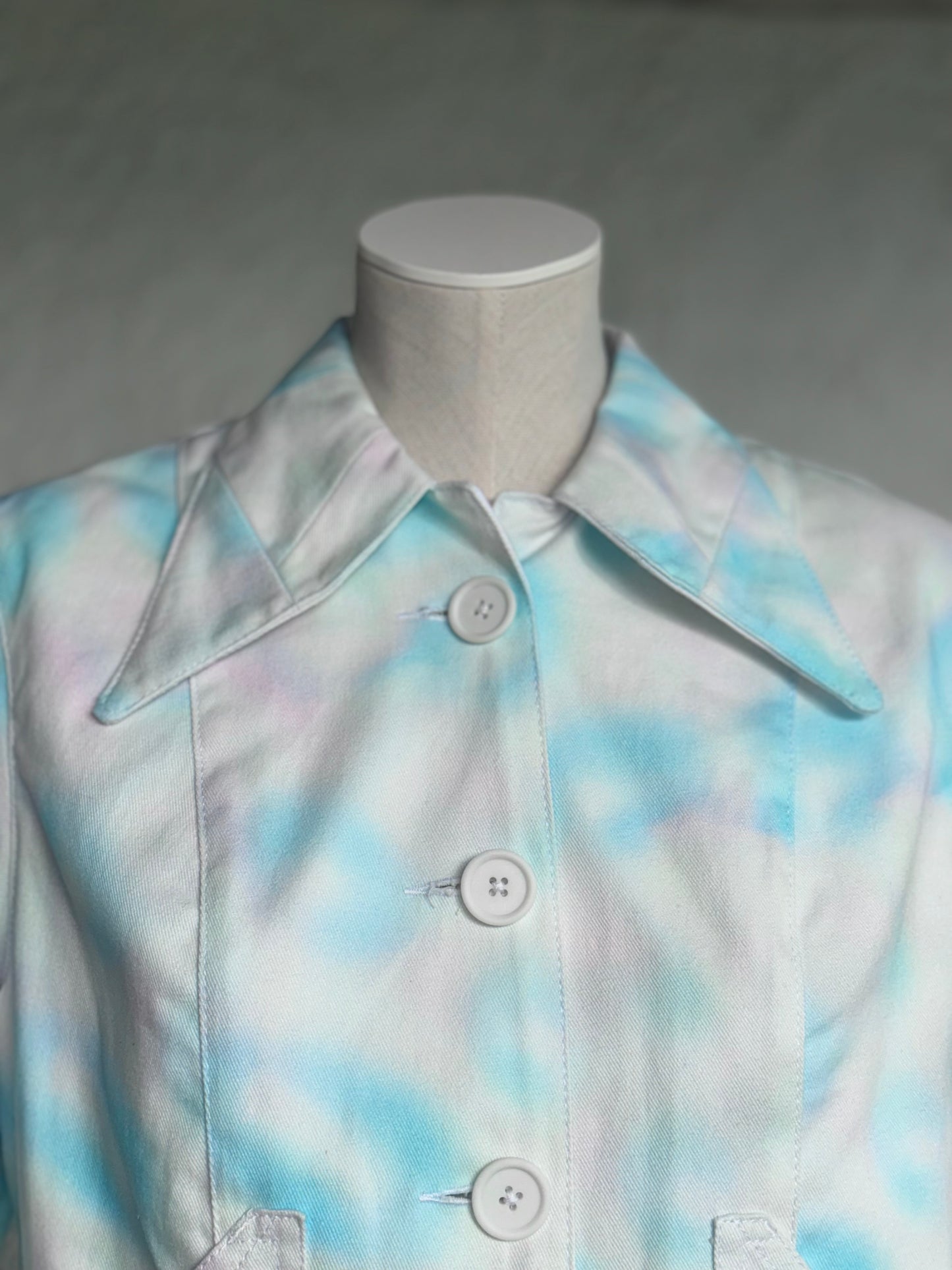 aqua blue spotted white denim jacket by KIOKU Studio close up