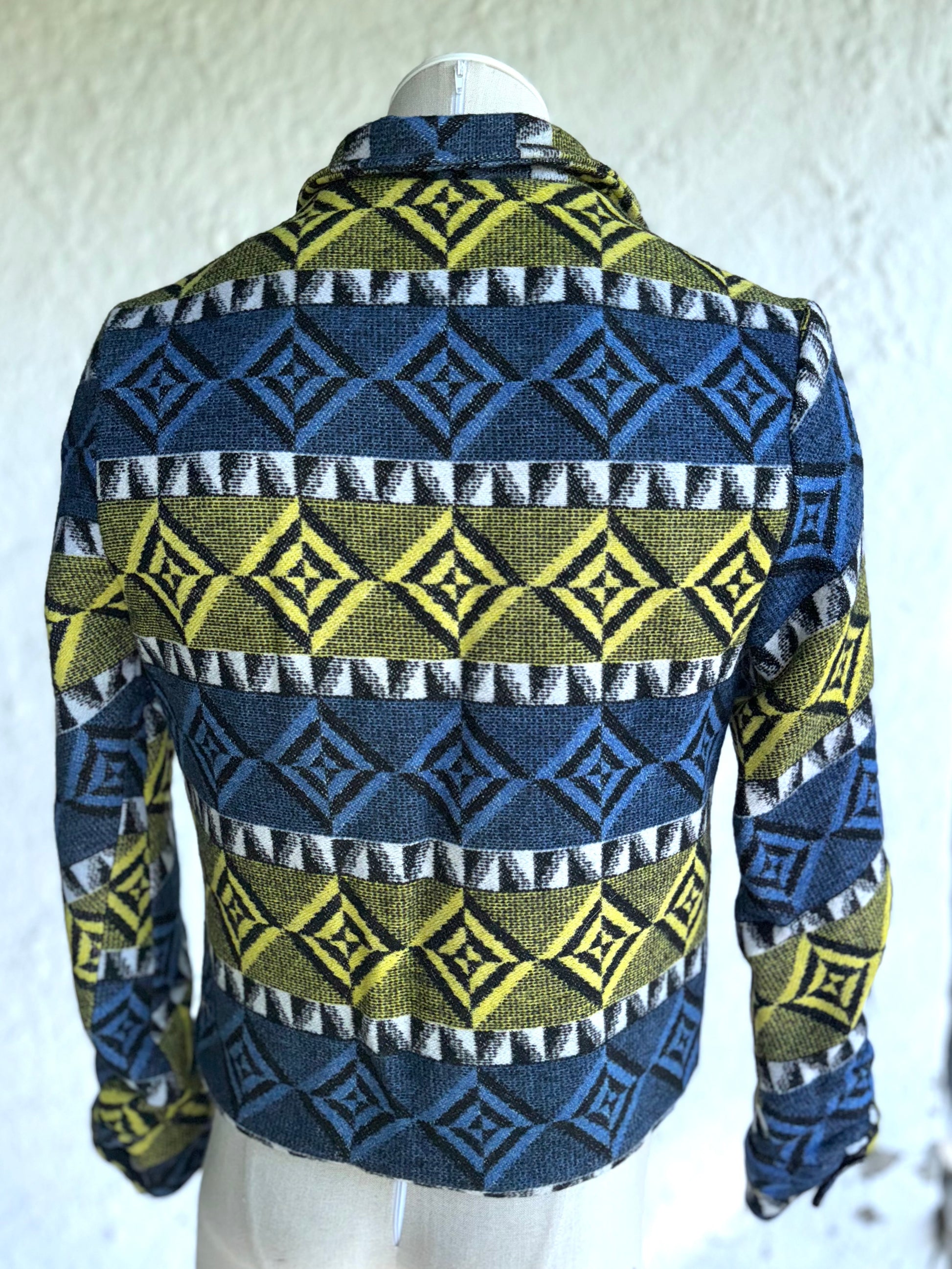 back of the blue and yellow one of a kind short jacket