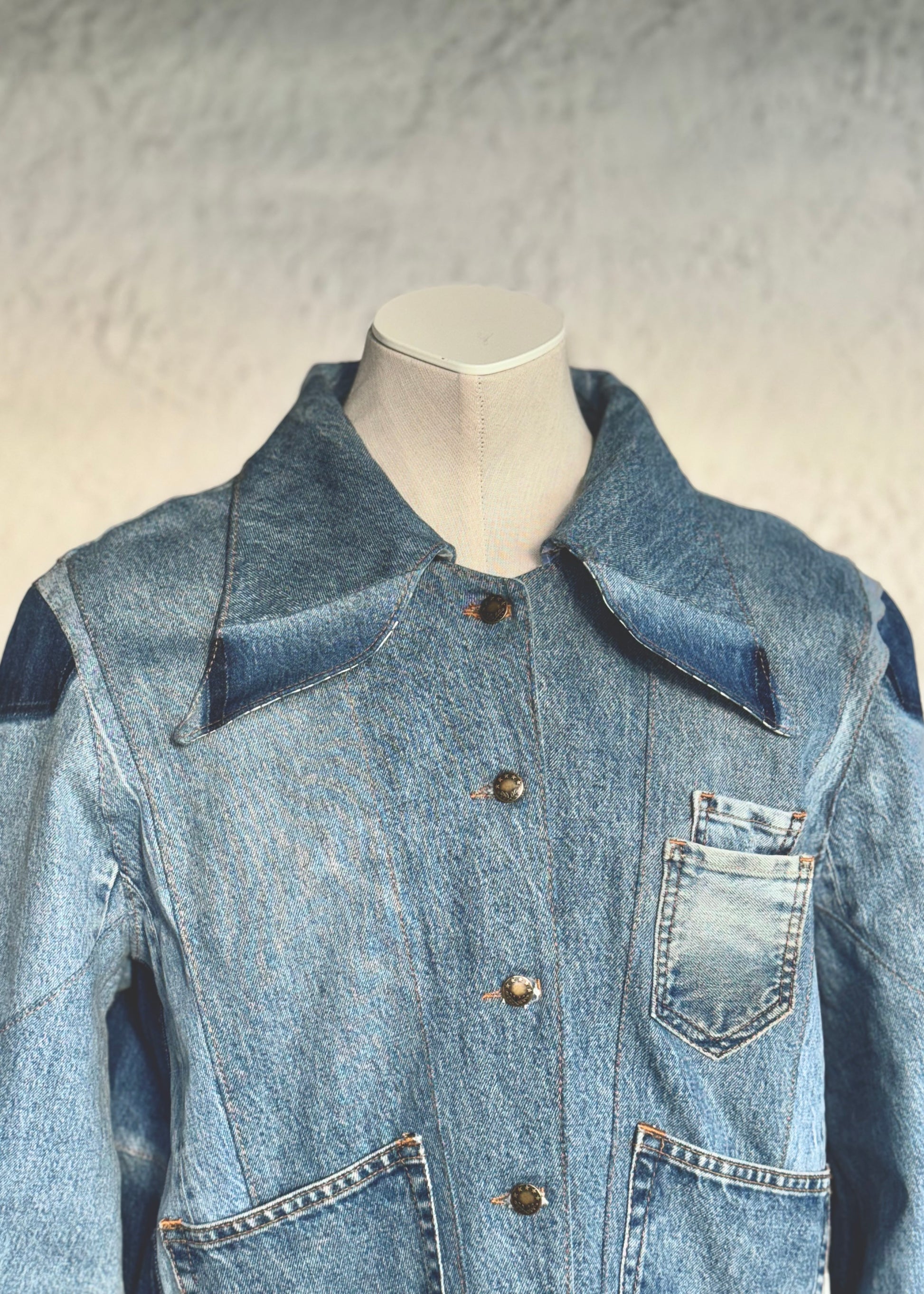 One of a kind blue denim jacket by KIOKU Studio close up
